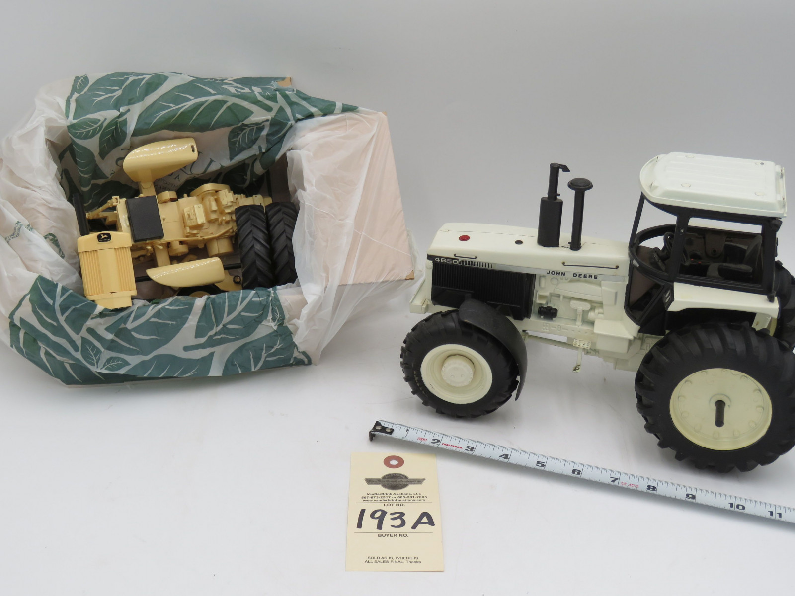 LOT OF 2 (JOHN DEERE WHITE TRACTOR 4650 NO BOX METAL)(JOHN DEERE 730 DIESEL BROKEN IN MANY PIECES PLASTIC MAY BE MISSING PARTS ) 1/16TH SCALE - Image 1