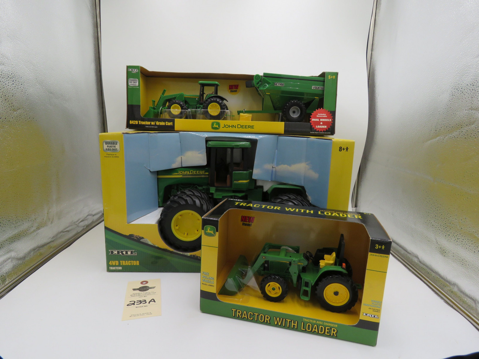 2002 Ertl for John Deere Tractor with loader plastic die cast NIB and 2006 Ertl for John deere 4WD tractor plastic die cast NIB and 2004 ERTL for John Deere 8420 Tractor with grain cart plastic die cast NIB Selling as a group 1/16 scale - Image 1