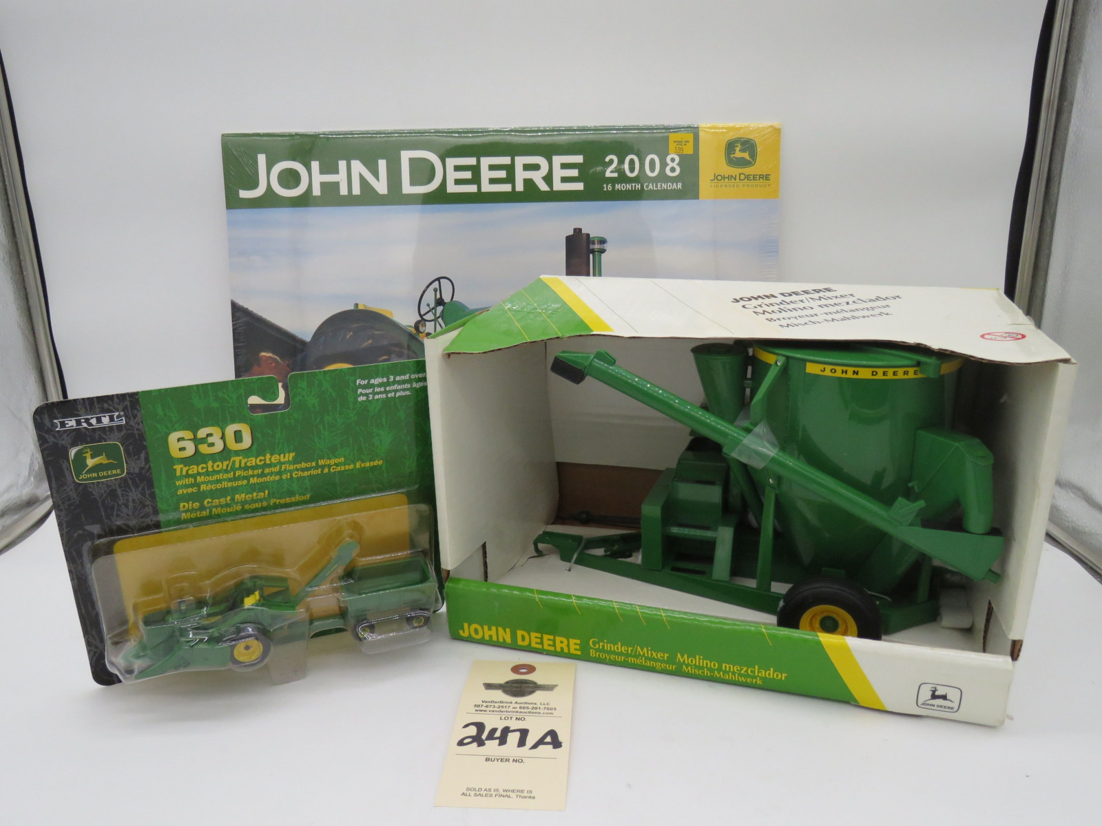 1998 Ertl John Deere Grinder/Mixer 1/16 Scale NIB #5002 and 2002 Ertl John Deere 630 Tractor Metal Die cast 1/64 Scale NIB and 2008 John Deere 16 month calender never been opened. Sold as a group of 3. - Image 1