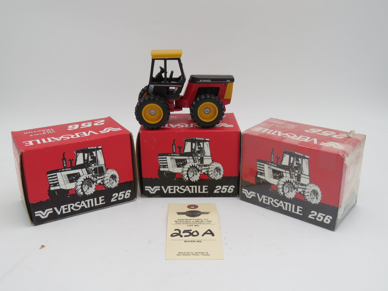 Versatile 256 1/32 scale Toy Tractor Ertl D, Iowa NIB and Versatile 256 1/32 Toy Tractor box still sealed Versatile 256 1/32 Scale Toy Tractor NIB. Sold as a group of 3. - Image 1