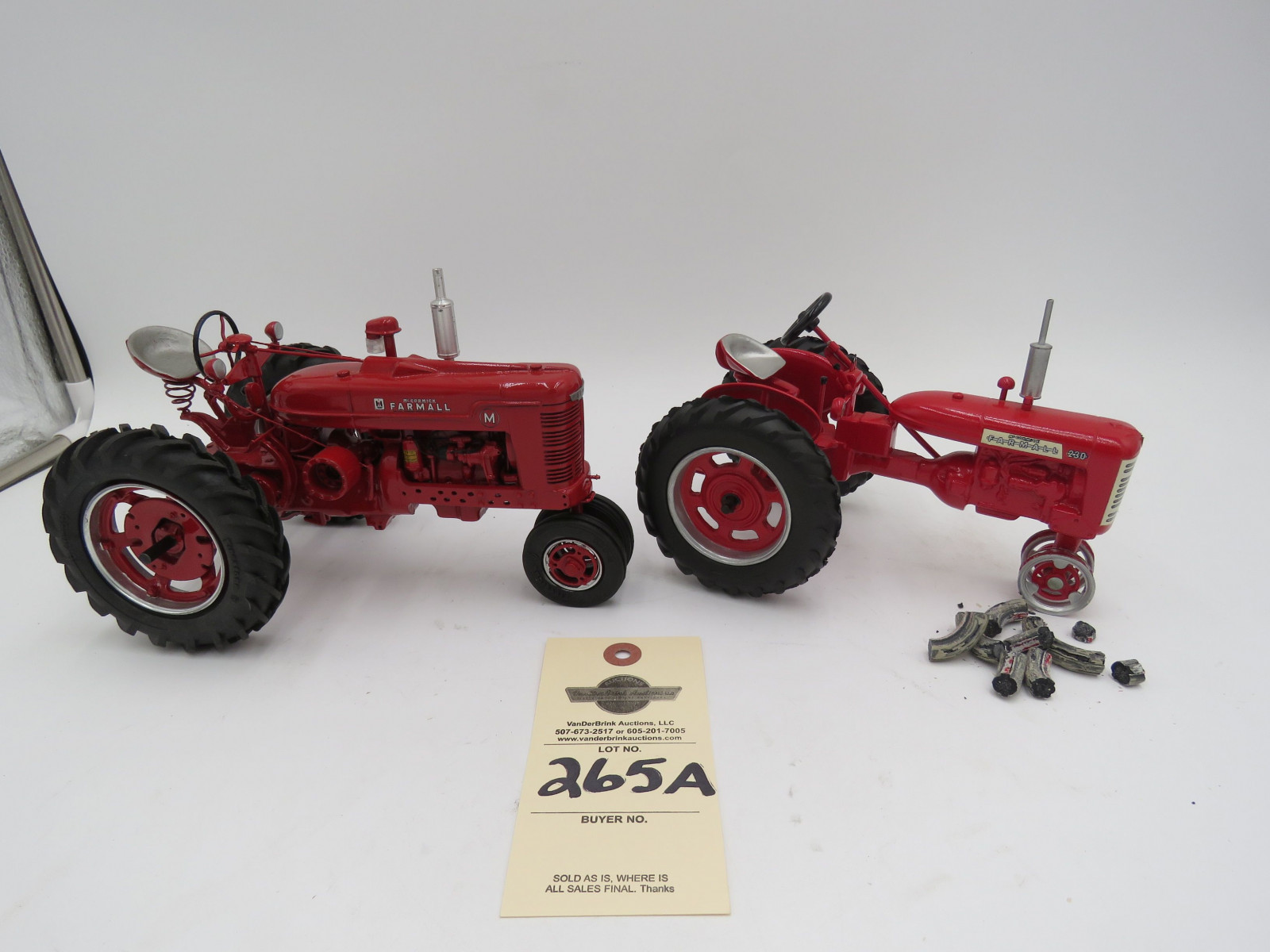 McCormick Farmall 230 metal diecast tractor. Missing front tires.1993 Mcormick Farmall M IH Metal Die cast tractor with Firestone tires. No boxes. Sold as a set of 2 1/16th Scale - Image 1