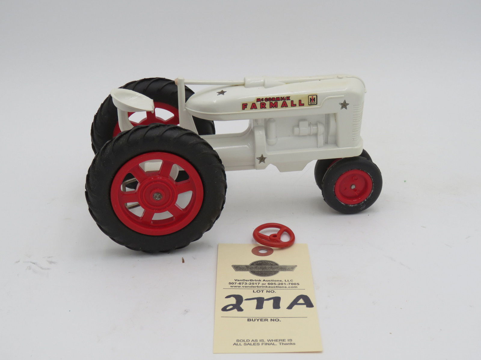 McCormick Farmall white plastic die-cast tractor. Opened box. Steering wheel  broke but provided in box. - Image 3