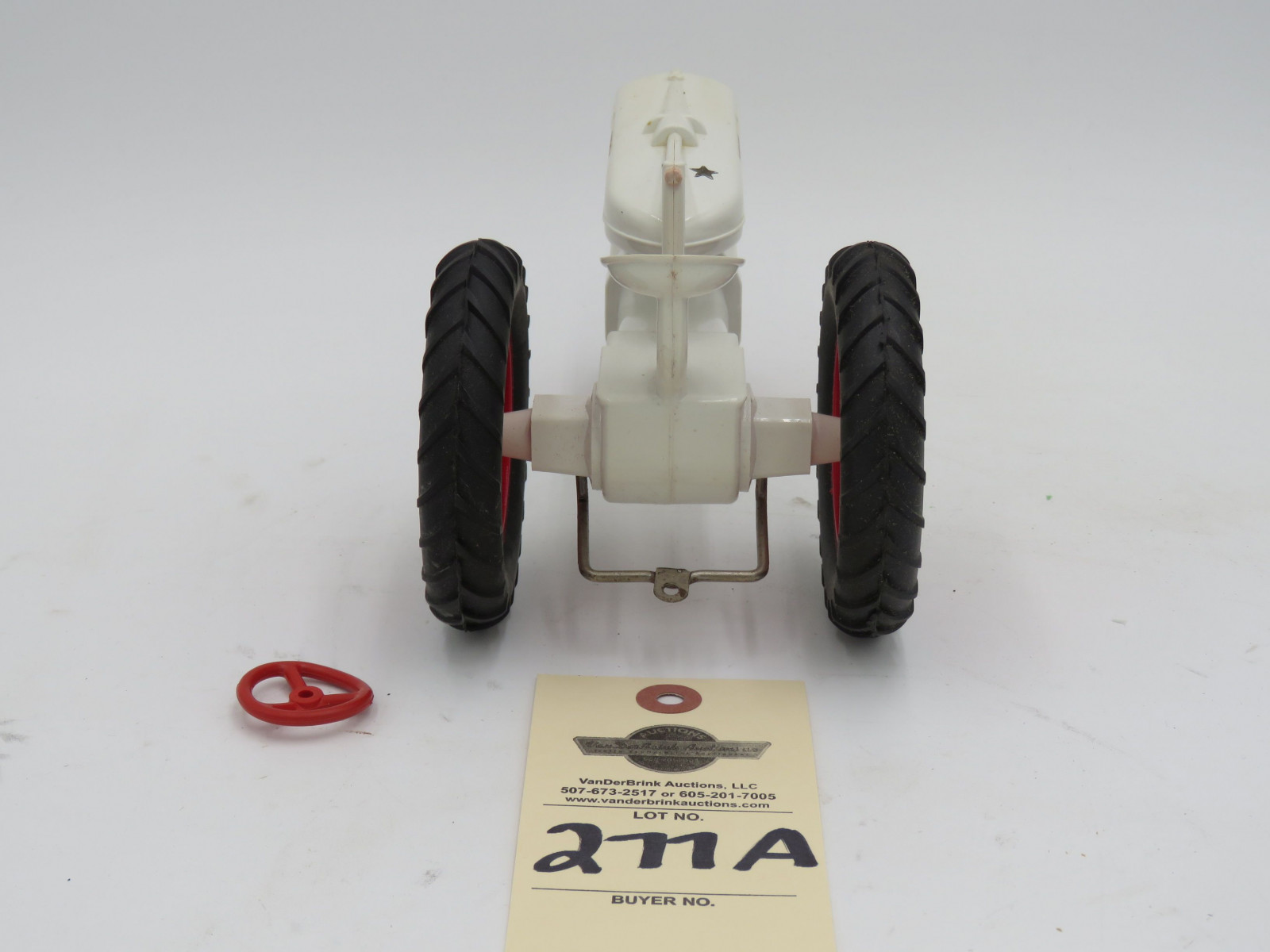 McCormick Farmall white plastic die-cast tractor. Opened box. Steering wheel  broke but provided in box. - Image 4