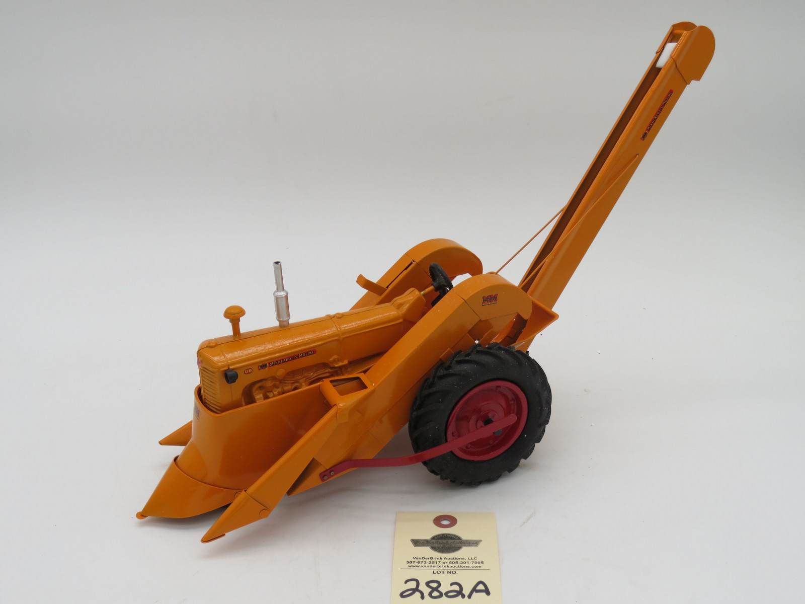 Minneapolis Moline UB with mounted picker custom build by Hernlan R. Metal diecast tractor. Orange with red accents. No box. - Image 1