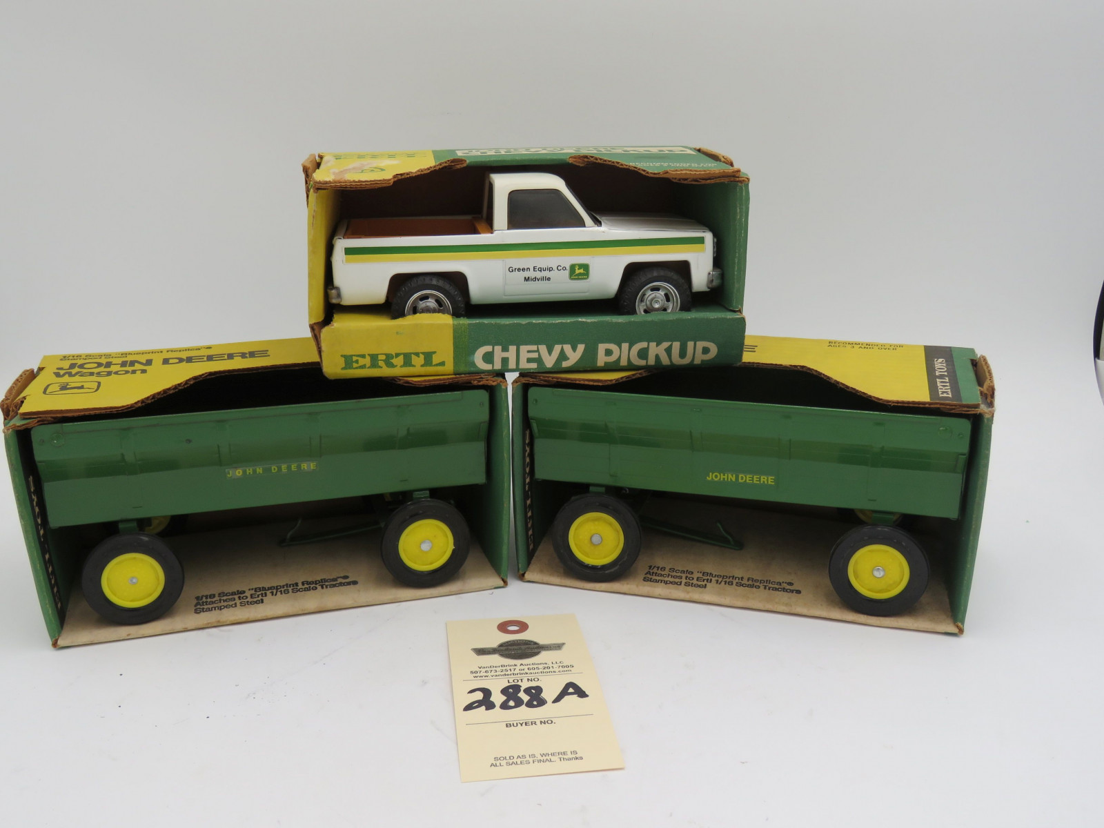 Ertl John Deere Chevy Pickup Steel Die-cast. Ertl John Deere Wagon 1/16 scale stamped steel die-cast wagon NIB. Ertl John Deere Stamped steel wagon 1/16 scale NIB. Sold as a lot of 3. - Image 1