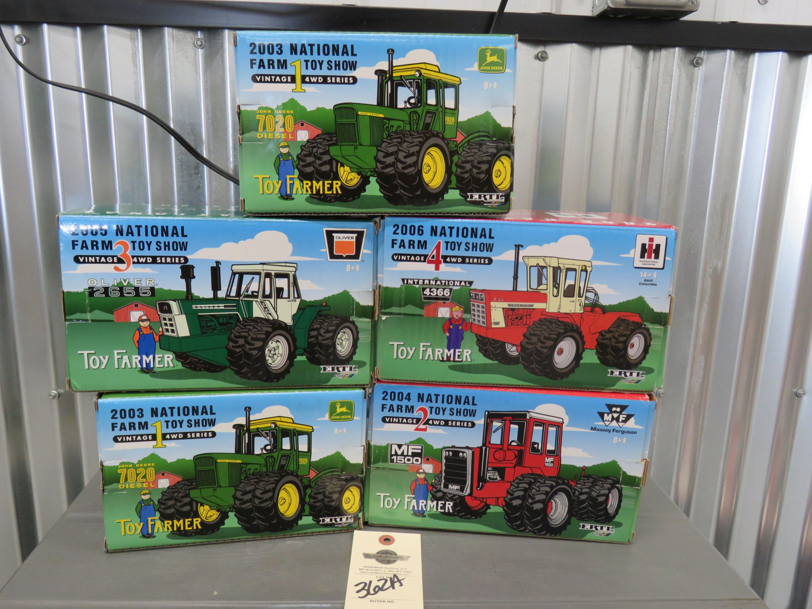 Toy Farmer by Ertl  Group of Vintage 4WD Series Tractors consisting of 2-2003 John deere 7020 Diesel both NIB, 2004 2 massey Ferguson 1500 4WD Tractor, 2005 Vintage 4WD Series Oliver 2655, and 2006 Vintage 4 International 4366 Tractor all NIB and 1/32nd Scale- Series - Image 1